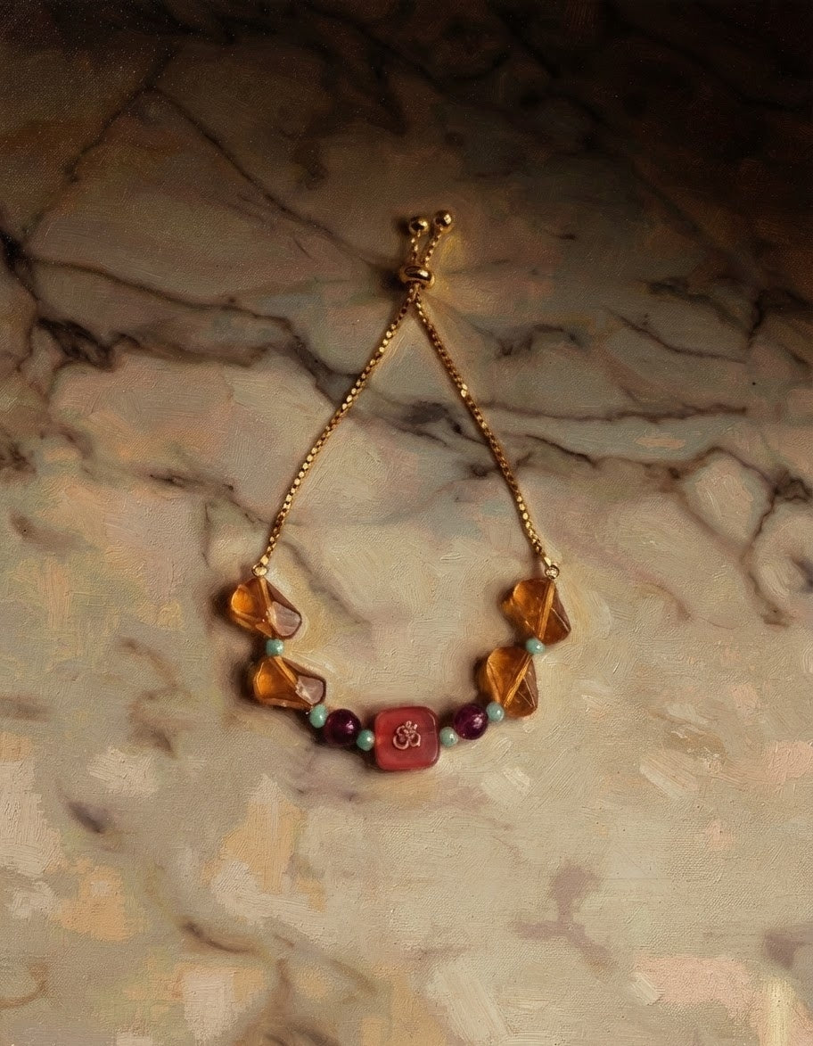 Orange Om Charm Rakhi Bracelet